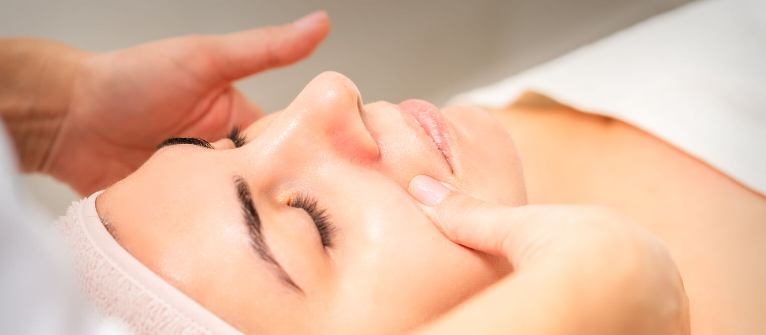 Close-up of a relaxing classic facial treatment with gentle hand massage.