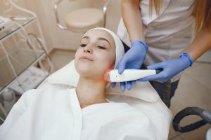 woman in cosmetology studio on laser hair removal